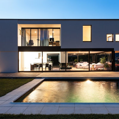 Pool - mid-sized contemporary backyard rectangular lap pool idea in Toronto