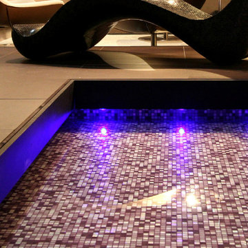 Modern indoor pool with purple toned mosaic mix