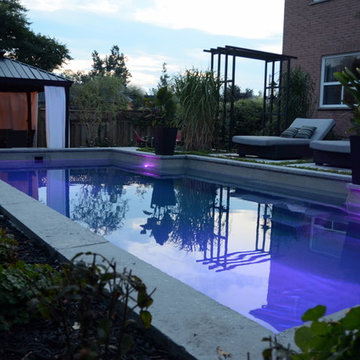 Modern Landscape with Fiberglass Pool, slab patio, water feature and more!