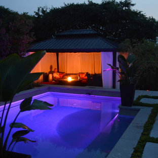 Modern Landscape with Fiberglass Pool, slab patio, water feature and more!