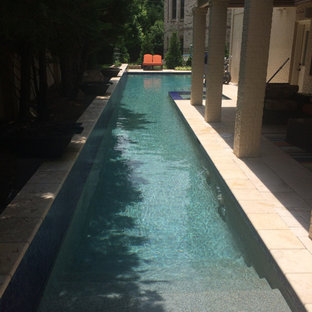 Esempio di una piccola piscina minimalista a "L" dietro casa con fontane e pedane