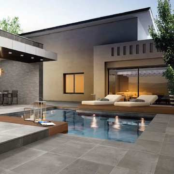 Modern pool with stone look porcelain tile throughout
