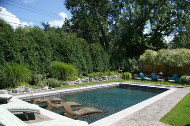 Pool - modern backyard stamped concrete and rectangular pool idea in New York