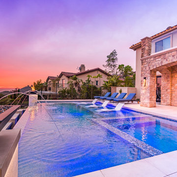 MODERN STYLE POOL AND SPA WITH A BREATHTAKING OUTDOOR KITCHEN & LIVING AREA