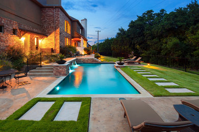 Minimalist backyard rectangular pool photo in Austin