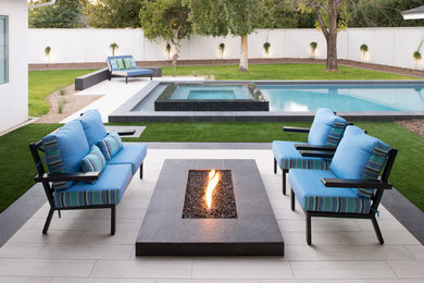 Large trendy backyard tile and rectangular lap pool photo in Phoenix