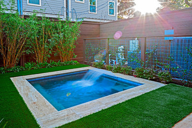 Inspiration for a small contemporary backyard stone and rectangular pool fountain remodel in Houston