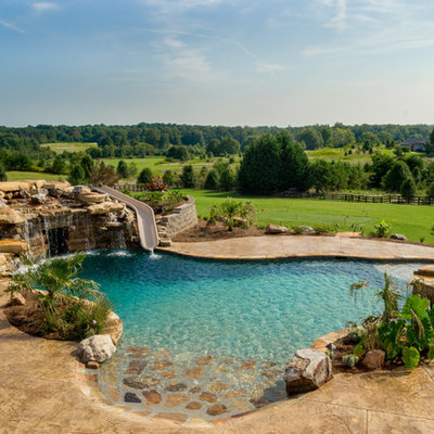 Inspiration for a huge rustic backyard stamped concrete and custom-shaped natural water slide remodel in Atlanta