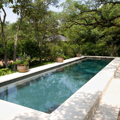 Inspiration for a large timeless backyard rectangular lap pool remodel in Austin