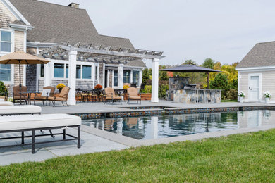 Pool - coastal backyard rectangular pool idea in Other