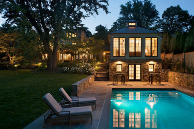 Inspiration for a backyard stone and rectangular pool house remodel in DC Metro