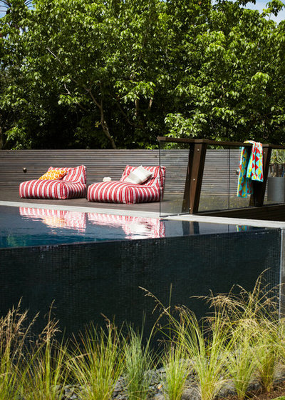 Contemporary Pool by Harrison's Landscaping