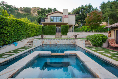 Inspiration for a mid-sized southwestern backyard tile and rectangular aboveground hot tub remodel in Los Angeles