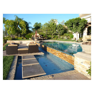 Multi-Tiered Stone and Tile Backyard Retreat - Mediterranean - Pool ...