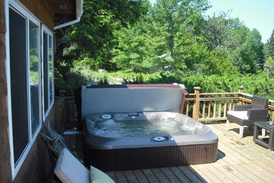 Inspiration for a traditional hot tub in Toronto with decking.