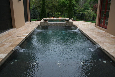 Hot tub - backyard rectangular hot tub idea in Dallas