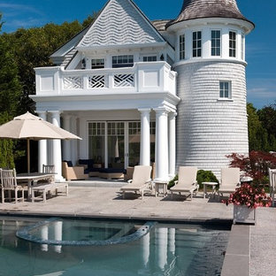 This is an example of a victorian rectangular pool in Boston with decomposed granite and a pool house.
