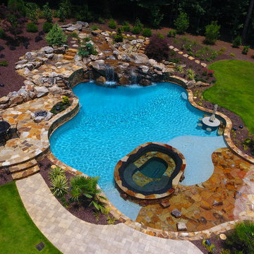 Natural freeform pool with Cave and Beach entry