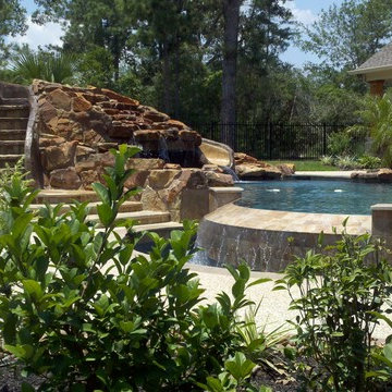 Negative Edge Pool with Gunite Cave Slide Waterfall and Beach Entry & Spa
