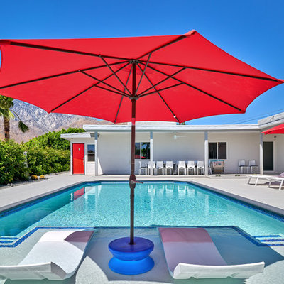 Mid-sized 1950s courtyard rectangular natural pool photo in Other