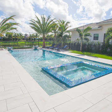New Infinity Edge Pool With Custom Spa, Sunshelf and Water Bowls in Delray Beach