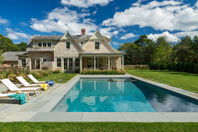 Pool - large coastal backyard stone and rectangular lap pool idea in Boston