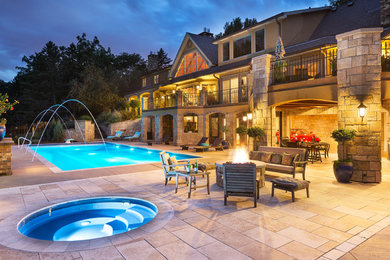 Photo of a large traditional back rectangular lengths hot tub in Minneapolis with concrete slabs.