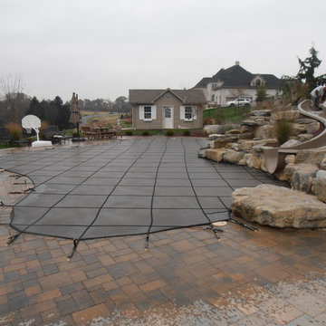 North Whitehall custom pool with boulder waterfall, slide, & separate spa
