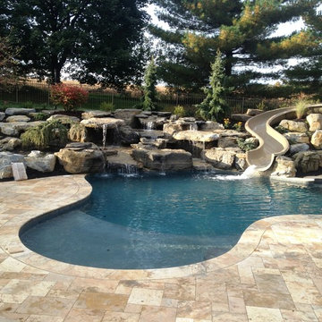 North Whitehall custom pool with spa, flume, sunshelf, and boulder waterfall