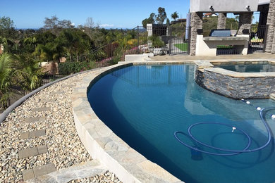 Trendy pool photo in San Diego