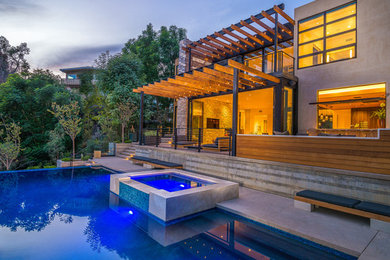 Inspiration for a large contemporary backyard rectangular infinity pool remodel in Los Angeles