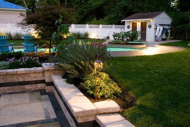 Pool - large backyard tile natural pool idea in Cleveland
