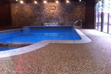 This is an example of a large indoor rectangular hot tub in Boston with tiled flooring.