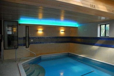 Pool - mid-sized contemporary indoor decomposed granite and rectangular pool idea in Chicago