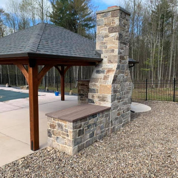 Outdoor Fireplace and Covered Patio with London Natural Thin Stone Veneer