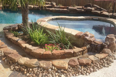 Large backyard custom-shaped pool photo in Houston