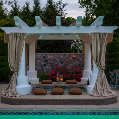 Inspiration for a large timeless backyard rectangular and concrete lap hot tub remodel in Other