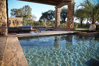 Tuscan pool photo in Dallas