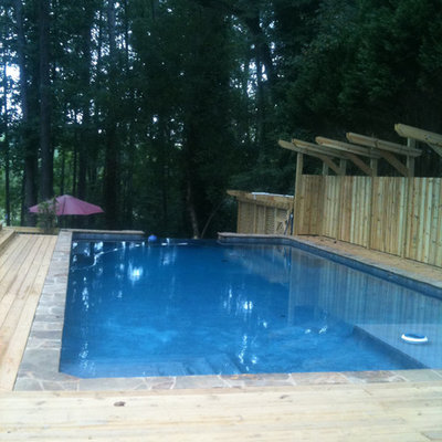 Pool - large traditional backyard rectangular lap pool idea in San Francisco with decking