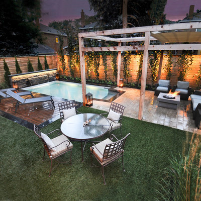 Inspiration for a timeless backyard rectangular pool fountain remodel in Toronto