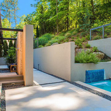 Outdoor shower with operable doors to yard and spa