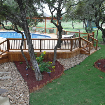 Oval above ground pool with deck