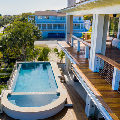 Minimalist aboveground pool photo in Charleston with decking