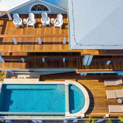 Inspiration for a modern aboveground pool remodel in Charleston with decking