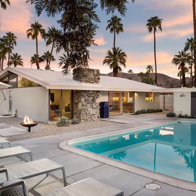 Mid-sized mid-century modern backyard rectangular pool photo in San Diego