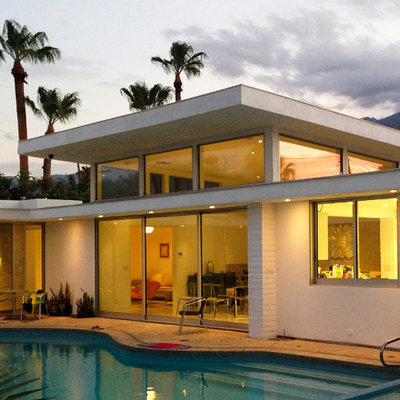 Hot tub - mid-sized 1960s courtyard concrete and custom-shaped hot tub idea in Los Angeles