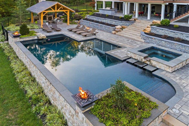 Inspiration for a modern backyard concrete paver pool remodel in Other
