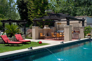 Pool fountain - mid-sized mediterranean backyard rectangular and tile lap pool fountain idea in Los Angeles