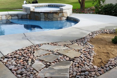 Small trendy backyard concrete and custom-shaped lap hot tub photo in Other
