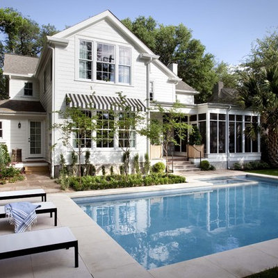 Pool - traditional backyard stamped concrete and l-shaped pool idea in Austin